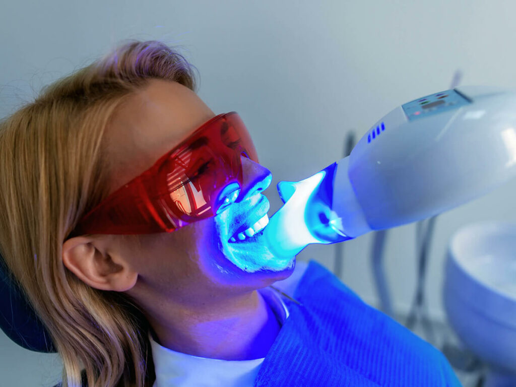 woman getting teeth whitened