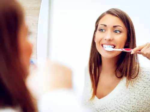 Brushing your teeth after a tooth extraction in Romeoville, IL